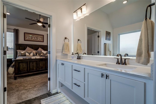 4145 Thunderhead Rd, Norman, OK 73072 - bathroom featuring a ceiling fan, double vanity, healthy amount of natural light, and vaulted ceiling