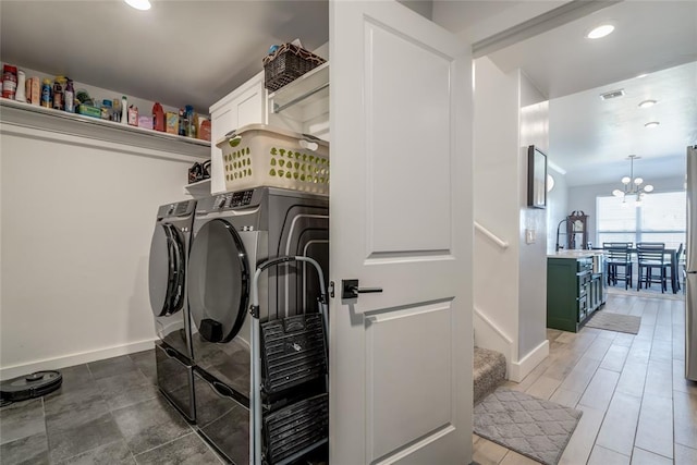 4145 Thunderhead Rd, Norman, OK 73072 - laundry area with independent washer and dryer, cabinet space, a chandelier, and recessed lighting