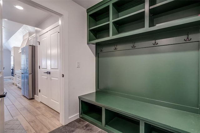 4145 Thunderhead Rd, Norman, OK 73072 - mudroom featuring baseboards and light wood-style flooring