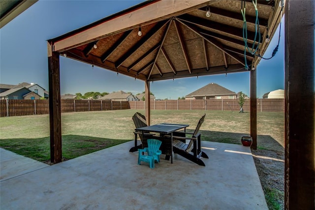 4145 Thunderhead Rd, Norman, OK 73072 - fenced backyard with a patio and outdoor dining area