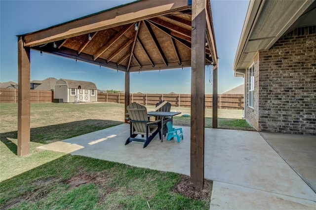 4145 Thunderhead Rd, Norman, OK 73072 - fenced backyard with a shed, a patio, and a gazebo