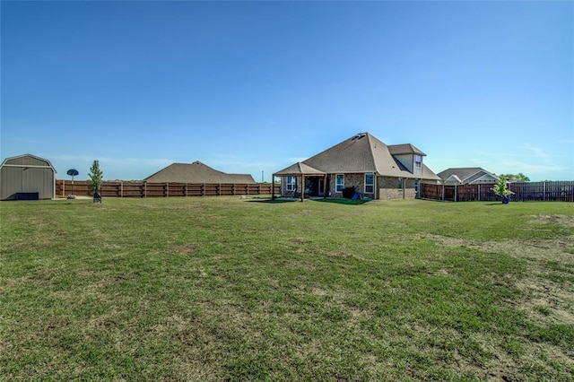 4145 Thunderhead Rd, Norman, OK 73072 - fenced backyard featuring a storage shed