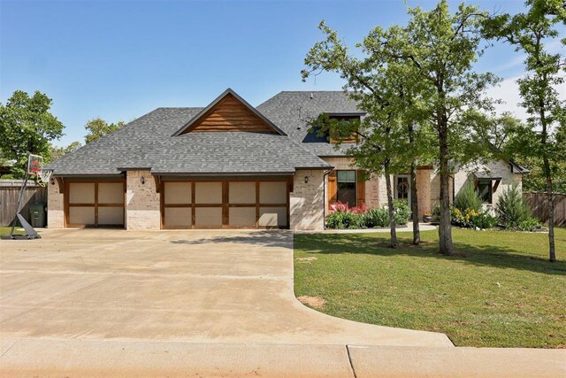 8350 Red Feather, Arcadia, OK 73007 - view of front of property with fence, a front lawn, an attached garage, driveway, and roof with shingles
