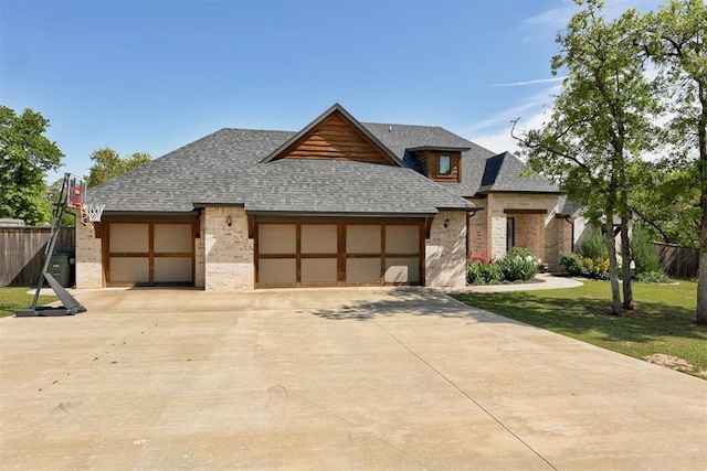 8350 Red Feather, Arcadia, OK 73007 - modern home featuring brick siding, an attached garage, fence, and roof with shingles