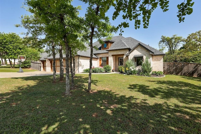 8350 Red Feather, Arcadia, OK 73007 - view of front of house with an attached garage, concrete driveway, a front yard, and fence