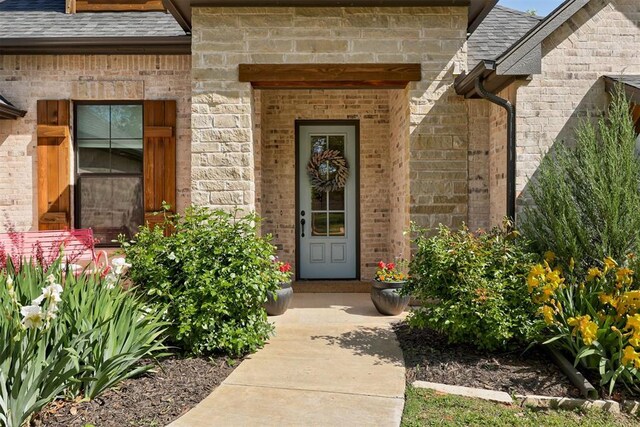 8350 Red Feather, Arcadia, OK 73007 - view of exterior entry with brick siding and roof with shingles