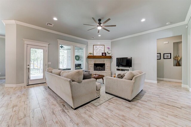 8350 Red Feather, Arcadia, OK 73007 - living area featuring a fireplace, visible vents, a ceiling fan, and baseboards
