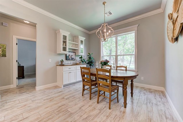 8350 Red Feather, Arcadia, OK 73007 - dining area with ornamental molding, a notable chandelier, visible vents, and light wood-type flooring