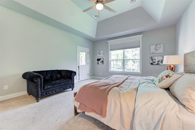 8350 Red Feather, Arcadia, OK 73007 - bedroom with visible vents, baseboards, a tray ceiling, and light colored carpet