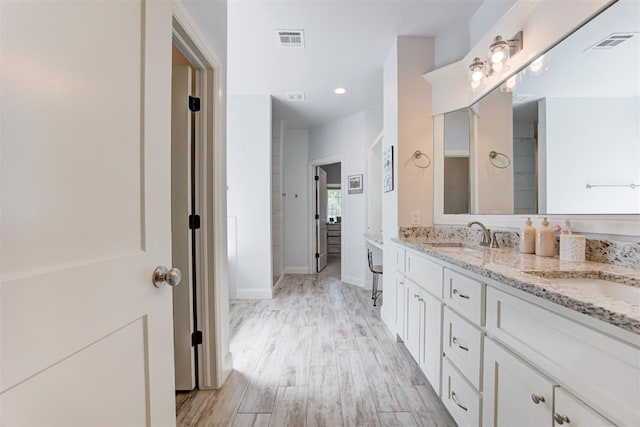 8350 Red Feather, Arcadia, OK 73007 - bathroom with wood finished floors, visible vents, and a sink