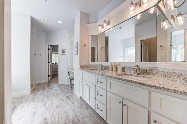 8350 Red Feather, Arcadia, OK 73007 - bathroom with double vanity, visible vents, and a sink