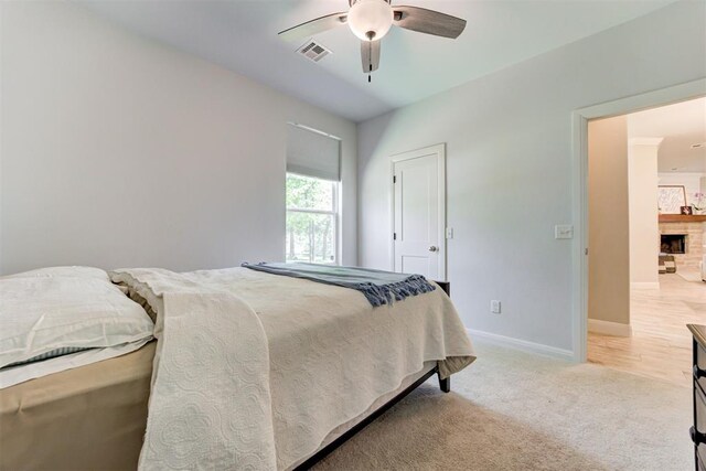 8350 Red Feather, Arcadia, OK 73007 - bedroom with visible vents, light carpet, baseboards, and ceiling fan