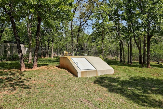 8350 Red Feather, Arcadia, OK 73007 - entry to storm shelter with a lawn and fence