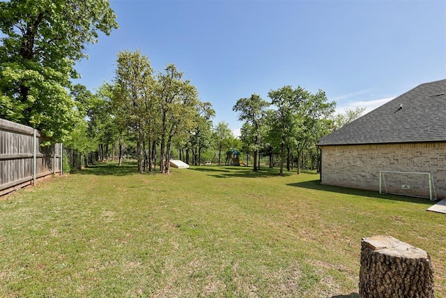 8350 Red Feather, Arcadia, OK 73007 - view of yard featuring fence and a playground