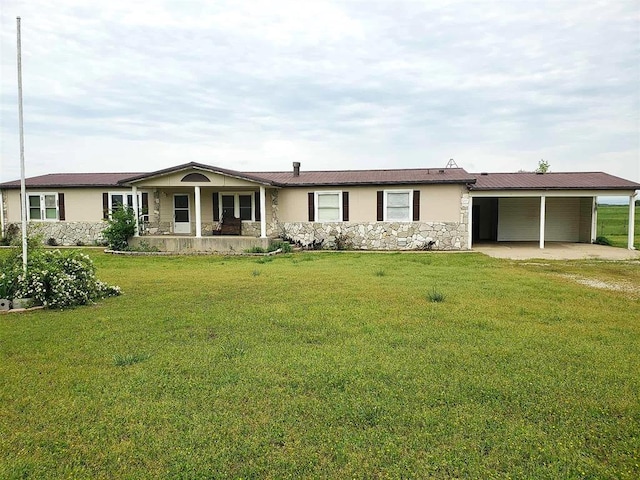 ranch-style house featuring stone siding, dirt driveway, stucco siding, a front yard, and a carport