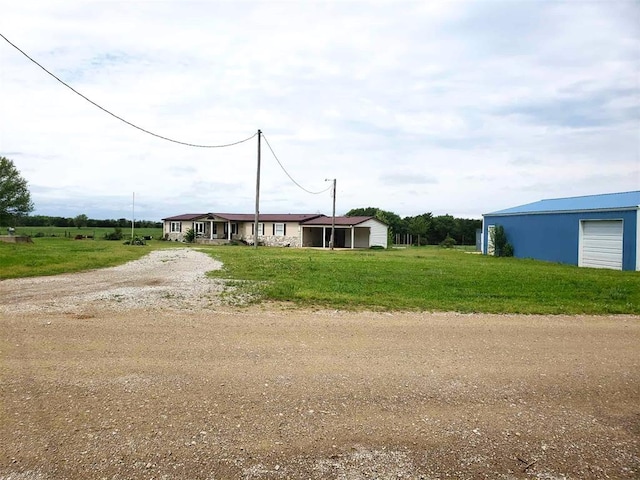 view of front of home with driveway and a front yard