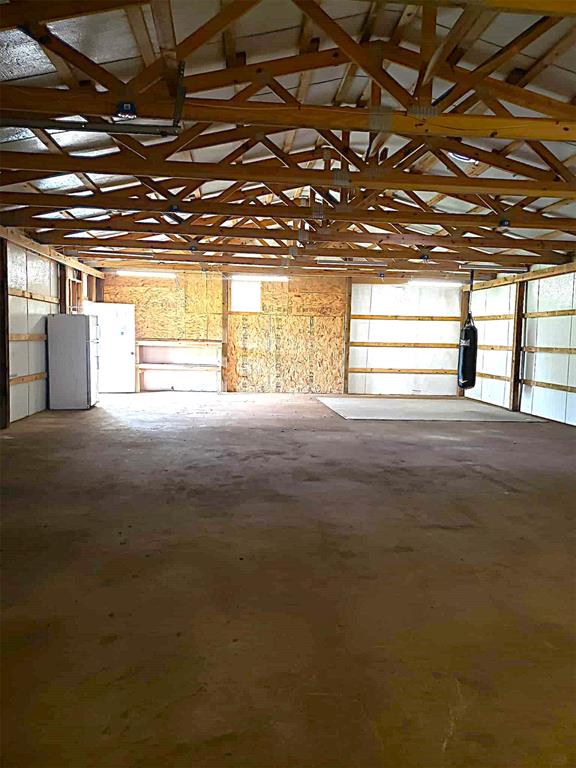 garage featuring freestanding refrigerator