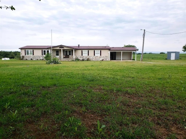 back of property featuring a lawn