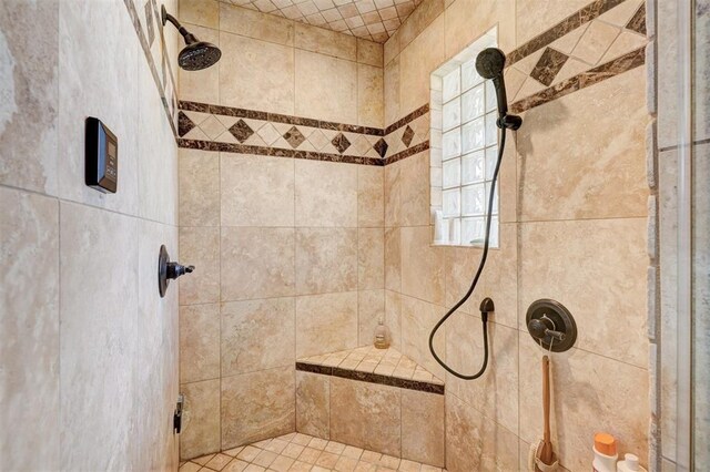 bathroom featuring tiled shower