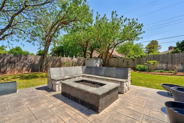 view of patio with a fenced backyard and an outdoor fire pit
