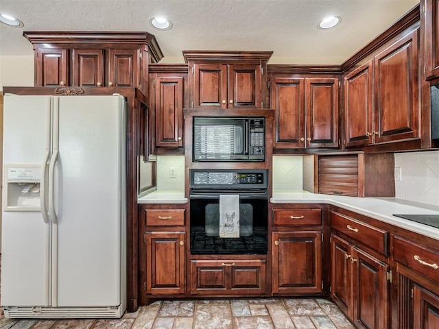 kitchen featuring recessed lighting, black appliances, backsplash, and light countertops