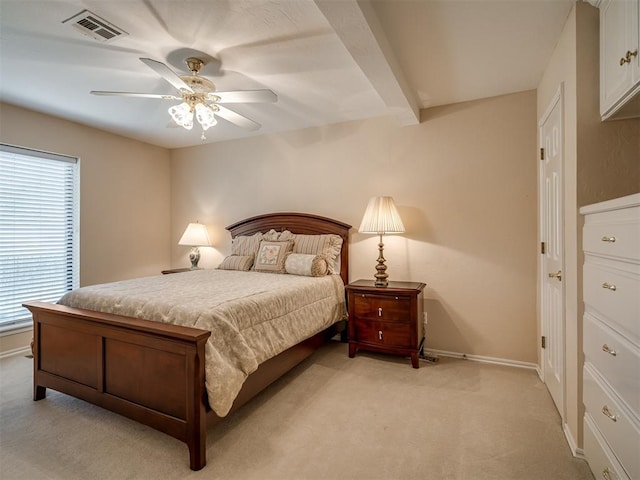 bedroom with baseboards, visible vents, a ceiling fan, and light carpet