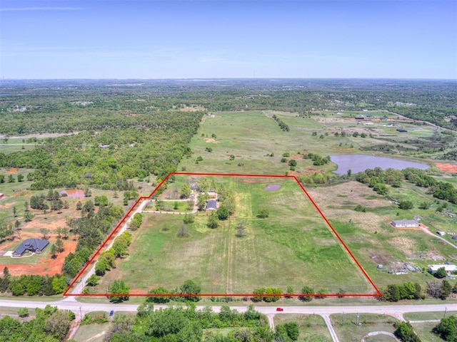 birds eye view of property with a rural view and a water view