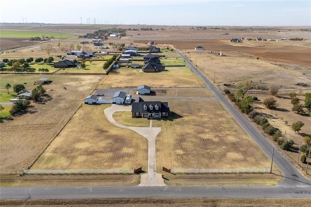 birds eye view of property with a rural view