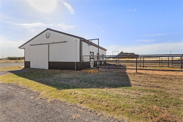view of pole building with fence