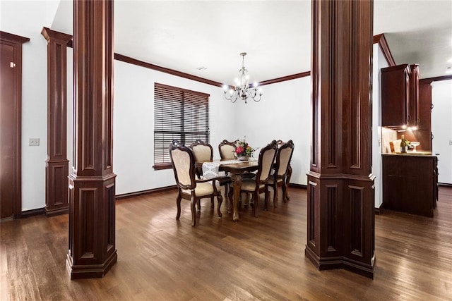 dining area featuring dark wood finished floors and decorative columns