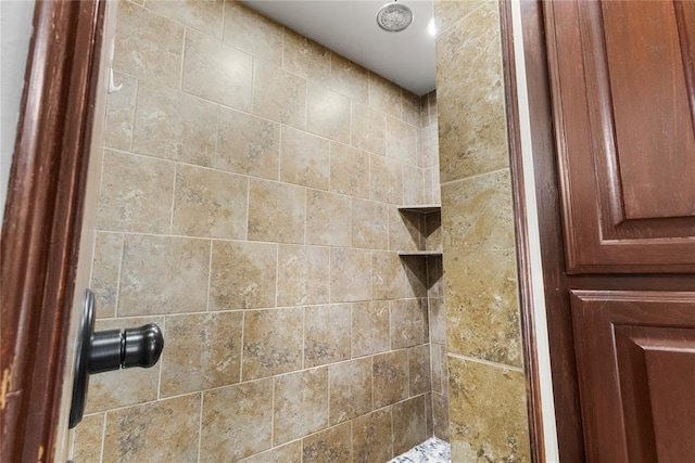 full bath featuring a tile shower