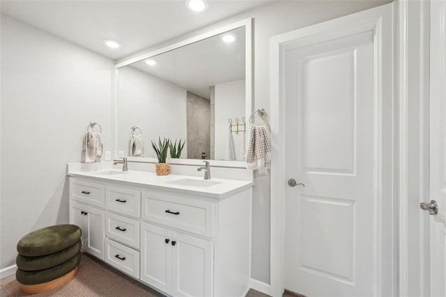 3320 Lola Ct, Moore, OK 73160 - full bathroom with tiled shower, double vanity, recessed lighting, and a sink