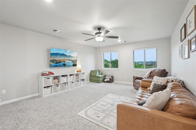 3320 Lola Ct, Moore, OK 73160 - living area featuring visible vents, carpet, baseboards, and a ceiling fan