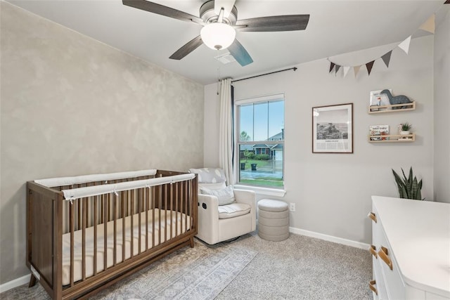 3320 Lola Ct, Moore, OK 73160 - bedroom featuring baseboards, a ceiling fan, carpet, and a nursery area