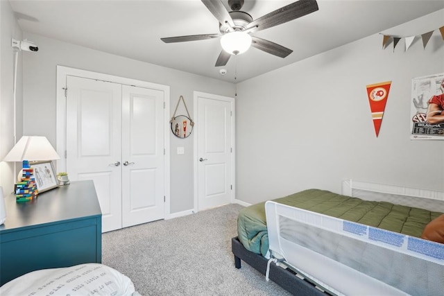 3320 Lola Ct, Moore, OK 73160 - bedroom with a closet, baseboards, ceiling fan, and carpet flooring