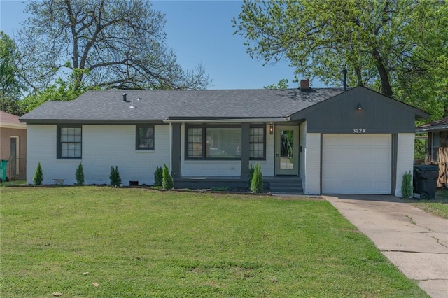 3224 NW 47th St, Oklahoma City, OK 73112 - ranch-style house featuring driveway, a front lawn, brick siding, and a garage