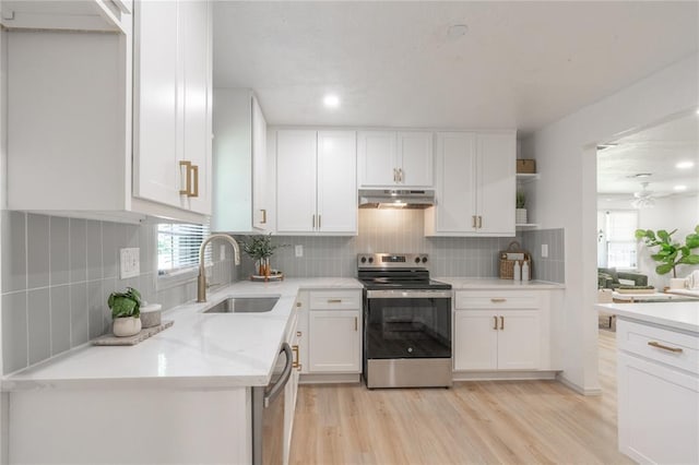 3224 NW 47th St, Oklahoma City, OK 73112 - kitchen with a sink, under cabinet range hood, ceiling fan, open shelves, and appliances with stainless steel finishes