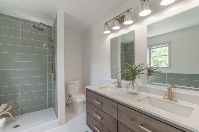 3224 NW 47th St, Oklahoma City, OK 73112 - full bathroom featuring toilet, double vanity, a sink, and tiled shower
