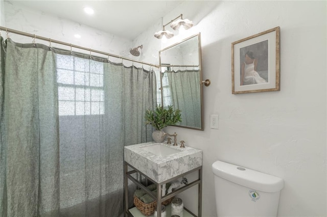 3224 NW 47th St, Oklahoma City, OK 73112 - bathroom with toilet, vanity, and curtained shower