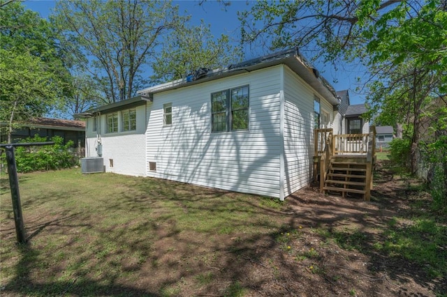3224 NW 47th St, Oklahoma City, OK 73112 - exterior space featuring a deck, stairway, and a lawn