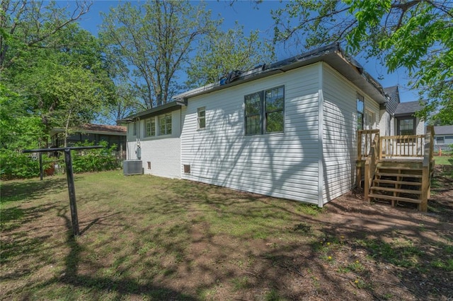 3224 NW 47th St, Oklahoma City, OK 73112 - view of side of home with a wooden deck and a yard