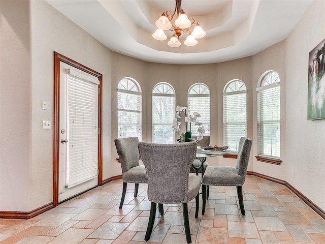 3401 Kentucky Way, Edmond, OK 73034 - dining room featuring a chandelier, stone tile floors, and a healthy amount of sunlight