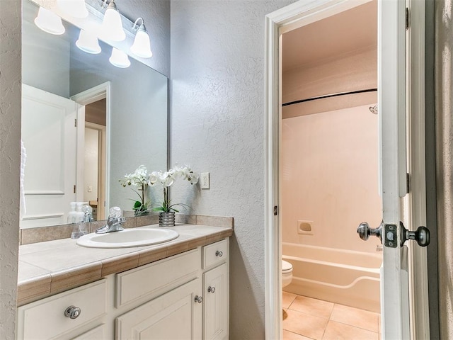 3401 Kentucky Way, Edmond, OK 73034 - full bath featuring shower / bathing tub combination, vanity, a textured wall, toilet, and tile patterned flooring