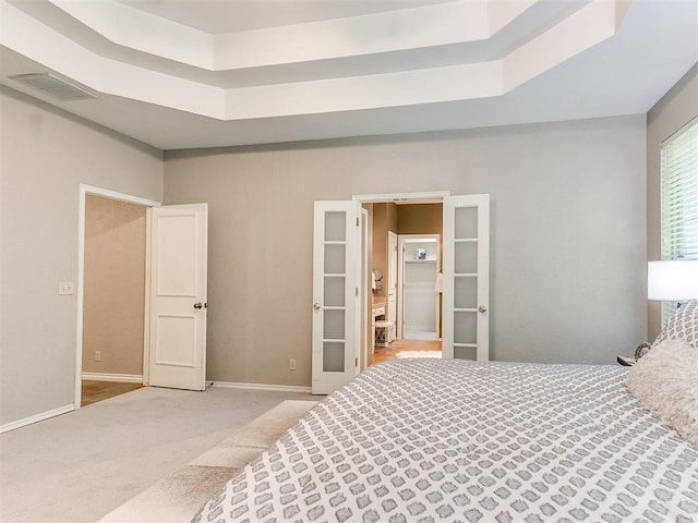 3401 Kentucky Way, Edmond, OK 73034 - carpeted bedroom with baseboards, a tray ceiling, and visible vents