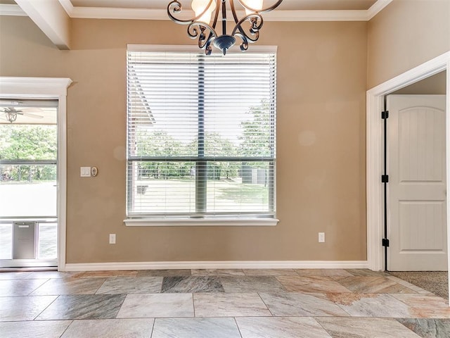interior space with plenty of natural light, ornamental molding, and an inviting chandelier