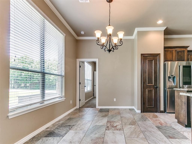 kitchen with stainless steel fridge, baseboards, crown molding, and a notable chandelier