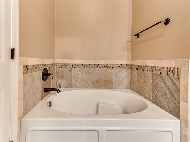 full bath with a garden tub