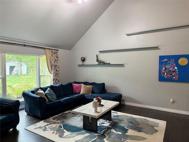 living room with wood-type flooring, baseboards, and vaulted ceiling
