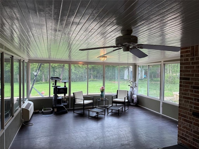sunroom / solarium with a ceiling fan