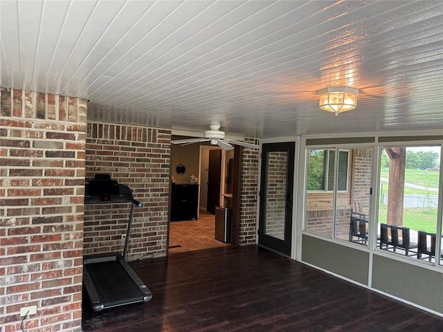 unfurnished living room featuring wood ceiling, ceiling fan, and wood finished floors